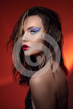 Beauty portrait of young beautiful girl in a nightclub at a party