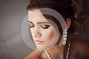 Beauty portrait of young bride. Perfect makeup and hairstyle.