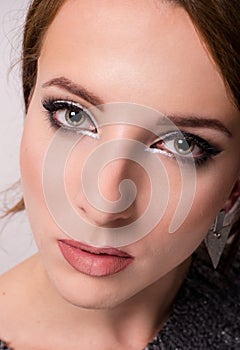 Beauty portrait of a young grey eyed woman