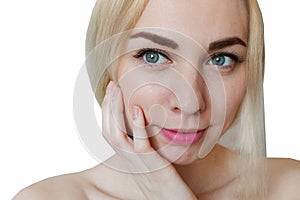 Beauty portrait of a young healthy attractive blonde woman standing isolated over white background, close up. Fashion, beauty, mak