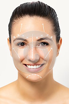 Beauty portrait of young woman with healthy skin and white surgical contour lines.