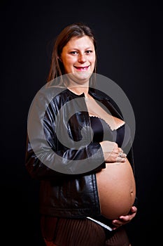 Beauty pregnant on black background