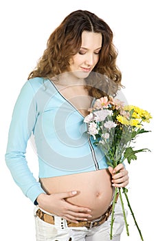 Beauty pregnant brunette with flower