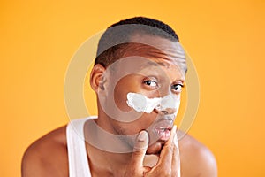 Beauty procedure and skin care, young manful man with face mask on around nose zone photo