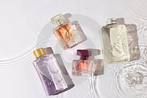 Beauty product bottles in water with copy space background on white background