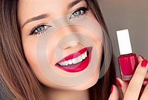 Beauty product, makeup and cosmetics, face portrait of beautiful woman with nail polish, manicure and matching red