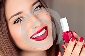 Beauty product, makeup and cosmetics, face portrait of beautiful woman with nail polish, manicure and matching red