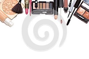 Beauty products for natural makeup on white with copy space