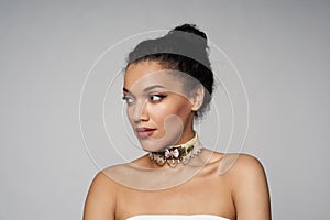 Beauty profile portrait of beautiful mixed race woman wearing chocker