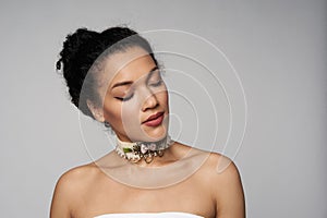 Beauty profile portrait of beautiful mixed race woman wearing chocker