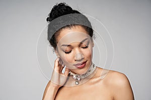 Beauty profile portrait of beautiful mixed race woman wearing chocker