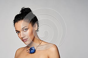 Beauty profile portrait of beautiful mixed race woman wearing chocker