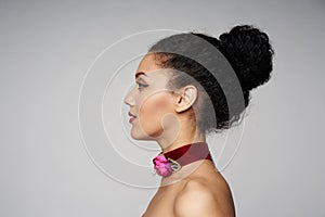 Beauty profile portrait of beautiful mixed race woman wearing chocker