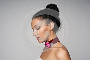 Beauty profile portrait of beautiful mixed race woman wearing chocker