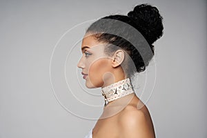 Beauty profile portrait of beautiful mixed race woman wearing chocker