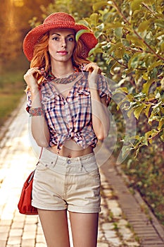 Beauty redhead woman smiling in the park, lifestyle, people