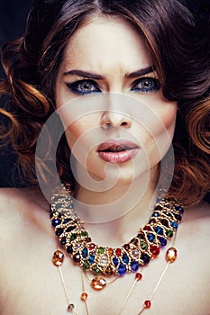 Beauty rich woman with bright makeup wearing luxury jewellery lo