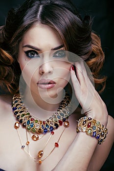 Beauty rich woman with luxury jewellery looks like mature close up, bright makeup