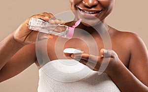 Beauty Routine. Closeup Of Black Female Using Micellar Water For Makeup Removing