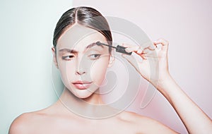 Beauty routine. Girl hold cosmetic applicator. Woman put makeup on her face. Daily makeup concept. Makeup and cosmetics