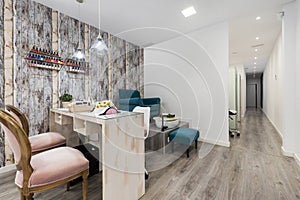 A beauty salon with booths to groom the clients\' nails