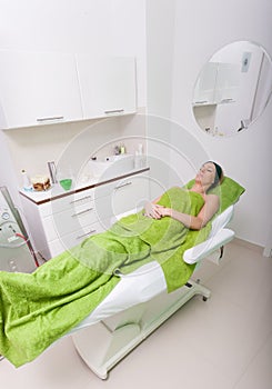 Beauty salon indoor. Woman relaxing in spa clinic