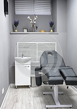 Beauty salon interior, modern room with procedure armchair in spa or wellness center