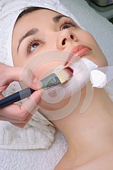 Beauty salon series. facial mask applying