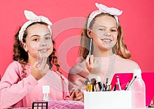 Beauty salon. Sisterhood happiness. Skin care. Kids makeup. Beauty and fashion. Happy girls doing makeup. Sisters play