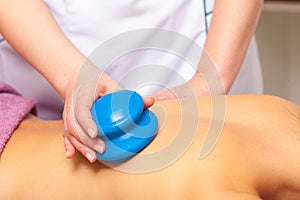 Beauty salon. Woman getting spa cupping glass vacuum massage