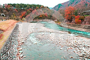 Beauty scenery clean green and blue water flow in canel rock from waterfall. Color leaves change tree on mountain. Landmark in jap