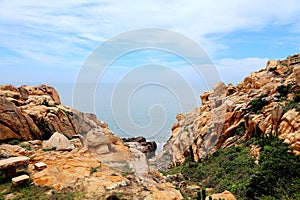 The beauty scenery of Rocky shore and mountains on Meizhou Island