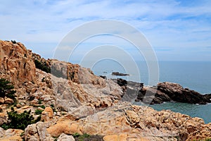 The beauty scenery of Rocky shore and mountains on Meizhou Island
