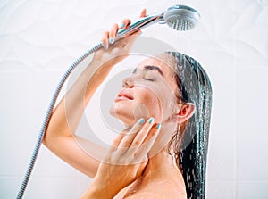 Beauty model girl taking shower photo