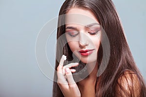 Beauty Skin Care. Beautiful Woman Applying Cosmetic Face Cream