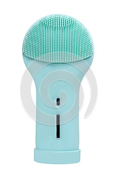 Beauty and skin care concept. Close-up of a modern blue turquoise, electrically rechargeable silicone brush for facial cleansing