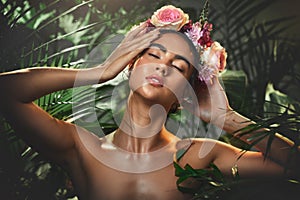 Beauty, skincare and flowers with woman in jungle for tropical cosmetics, spring and natural makeup. Exotic, forest and