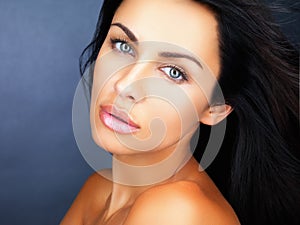 Beauty, skincare and healthy clean skin of a beautiful young woman with gorgeous blue eyes. Face portrait of a confident