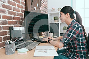 Beauty smiling female programmer using computer