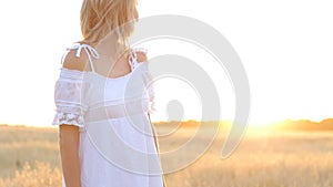 Beauty Smiling Girl on the Gold Field. Laughing And Happy young model woman