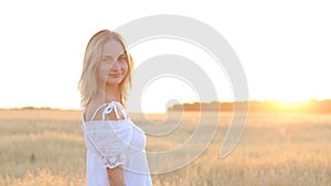 Beauty Smiling Girl on the Gold Field. Laughing And Happy young model woman