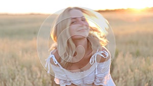 Beauty Smiling Girl on the Gold Field. Laughing And Happy young model woman