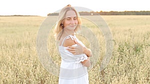Beauty Smiling Girl on the Gold Field. Laughing And Happy young model woman