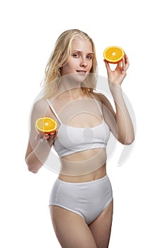 Beauty. Smiling woman with radiant face skin and orange portrait. Vitamin C cosmetics concept