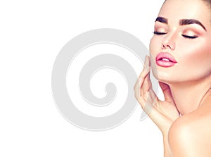 Beauty spa brunette woman touching her face. Skincare