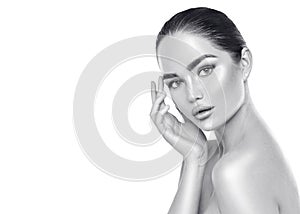 Beauty spa brunette woman touching her face. Skincare