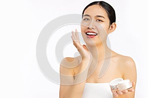 Beauty and spa concept, young asian woman portrait face with healthy skin applying cream on clean face white background