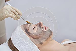 A beauty spa offers laser facial treatment. Woman undergoes a rejuvenating peel