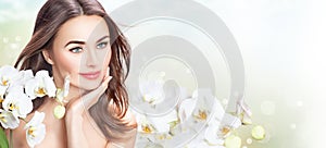Beauty spa woman with orchid flowers