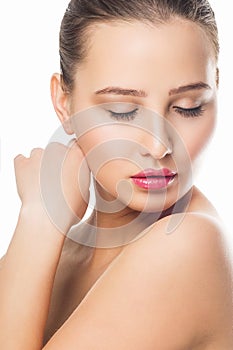 Beauty Spa Woman with perfect skin Portrait. Beautiful girl looking down